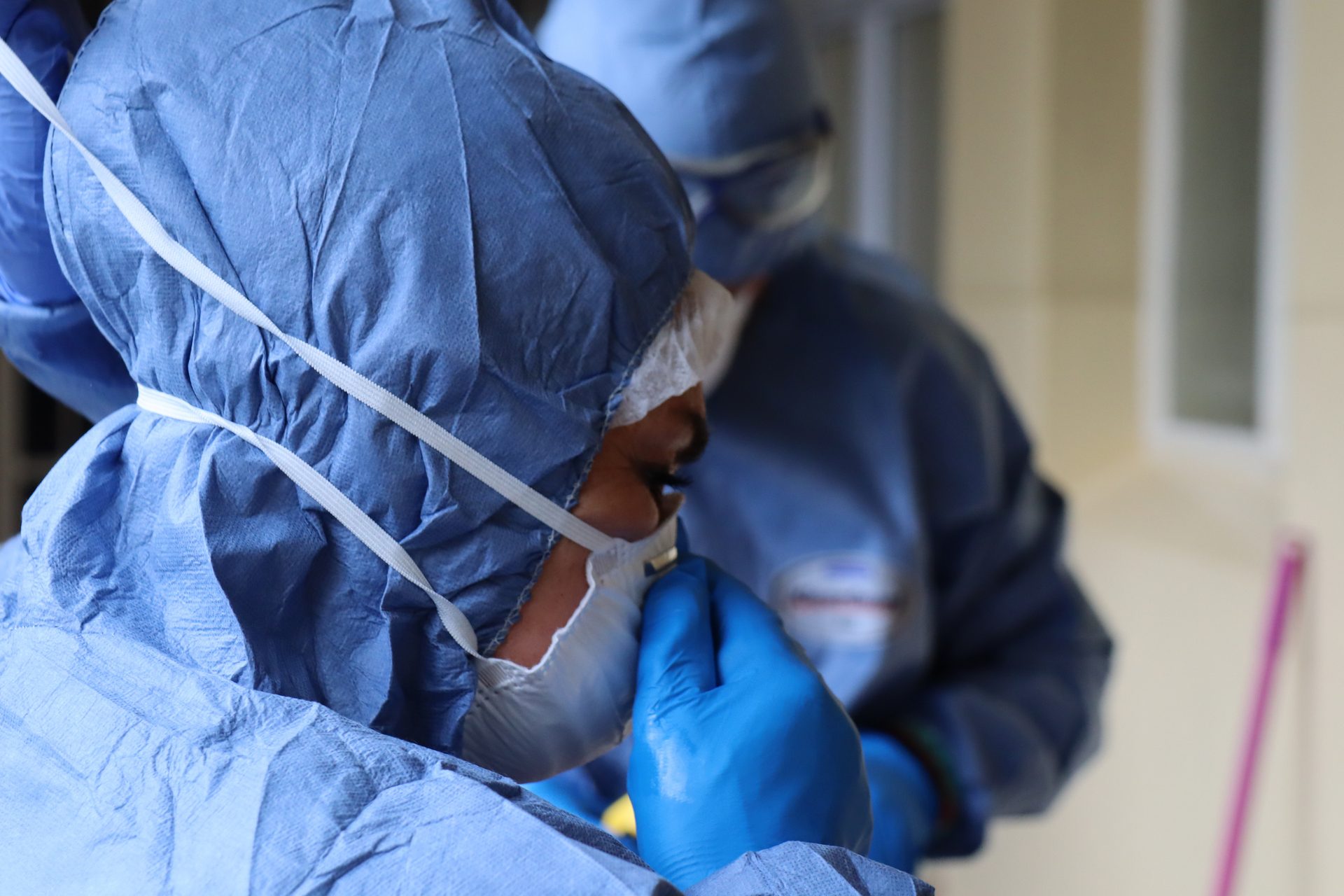 Trauma Cleansing technicians in full protective equipment preparing for a biohazard disinfection